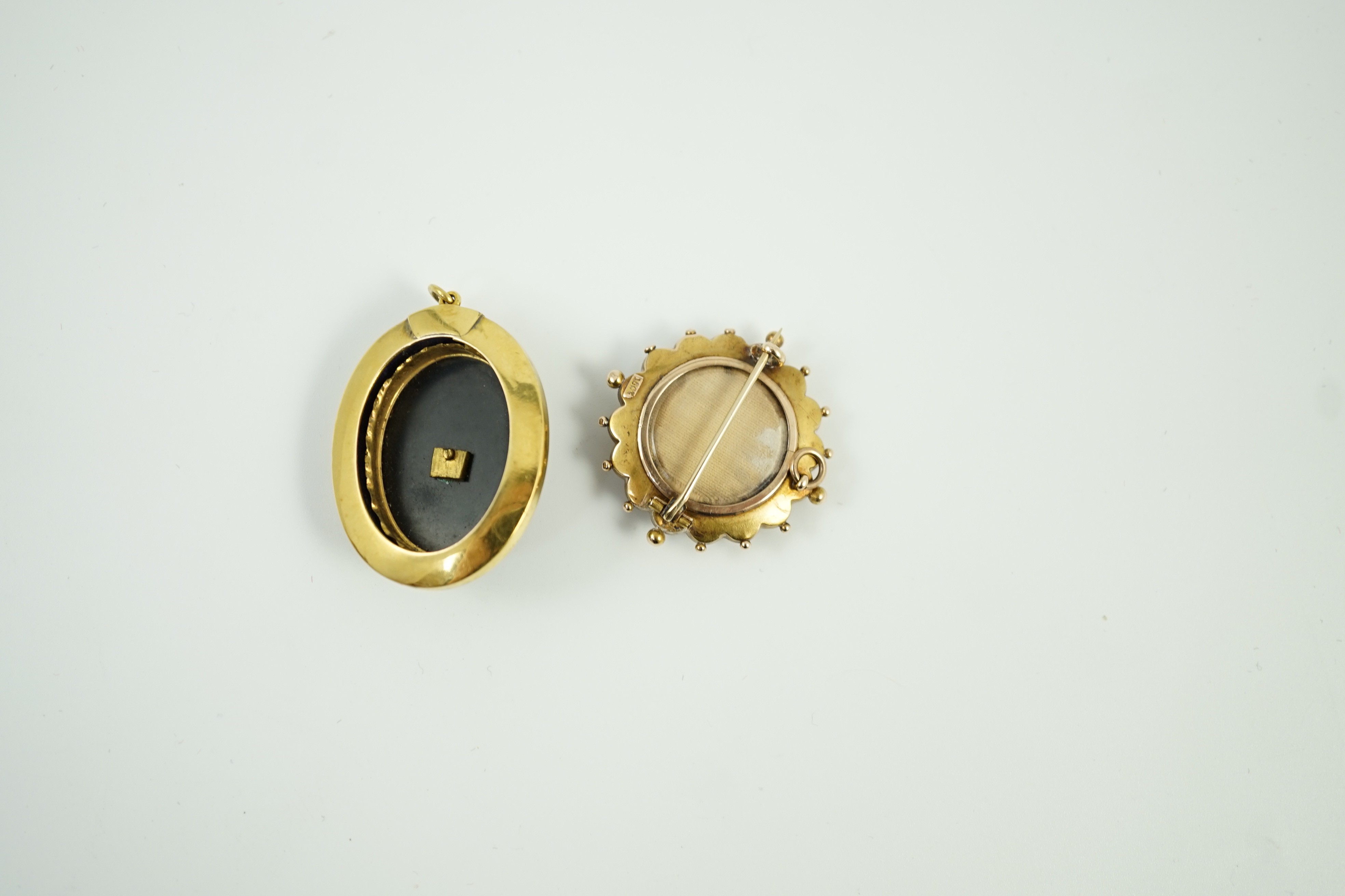 A Victorian yellow metal, black onyx, black enamel and split pearl set oval mourning pendant, 41mm and a Victorian 15ct, coral? and seed pearl set brooch, gross weight 21.5 grams.